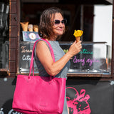 Woman holding an ice cream cone in front of a food truck