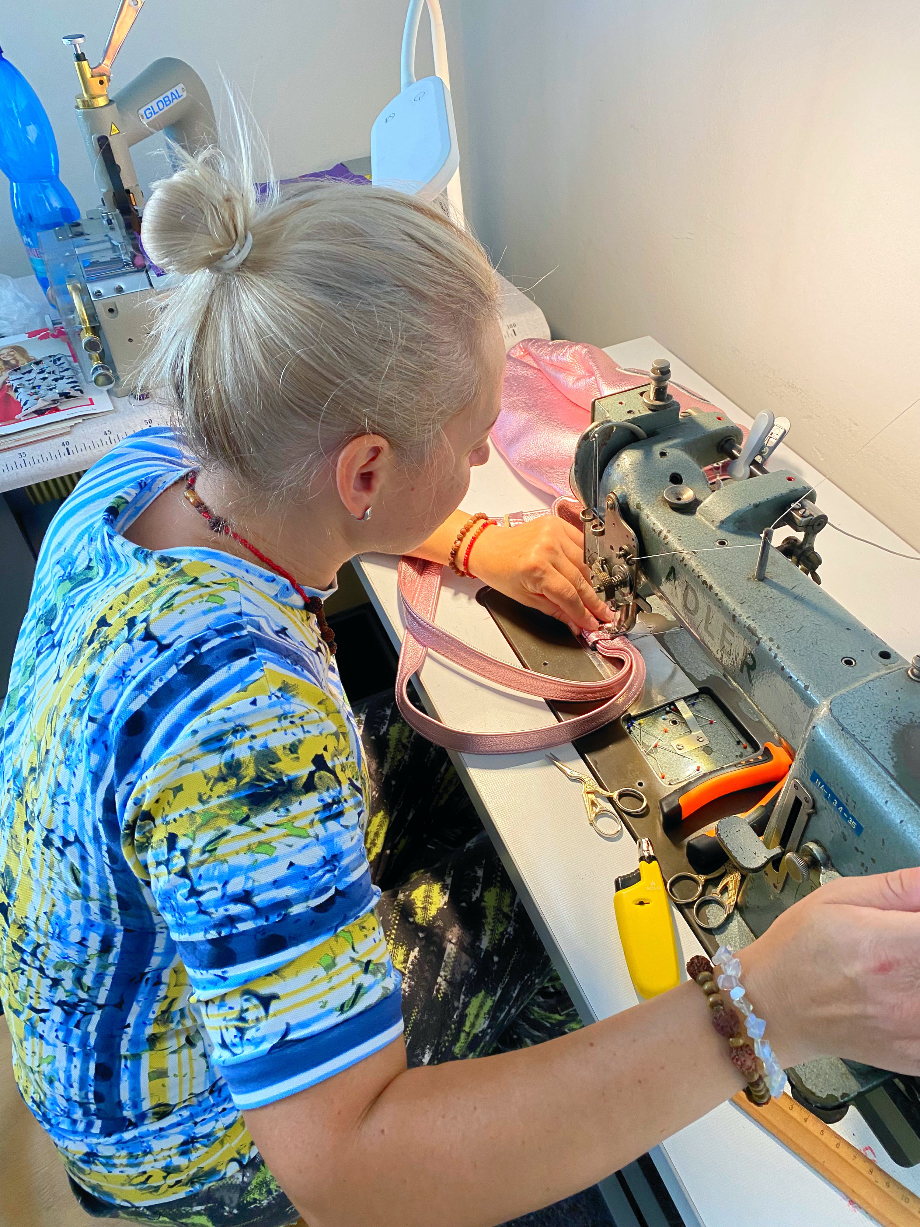 sewing machine in action creating bag