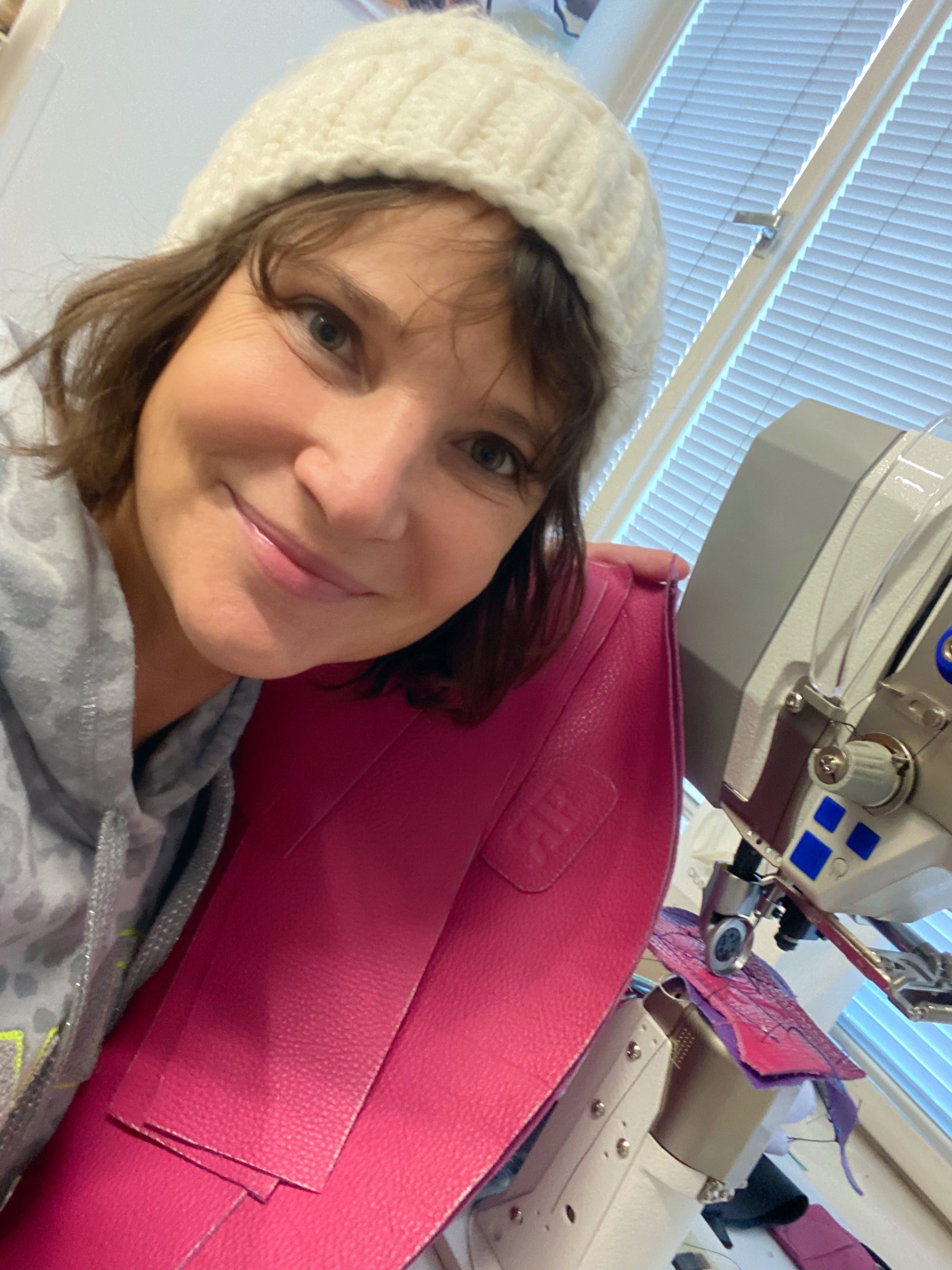 Radka creating leather handbag in atelier