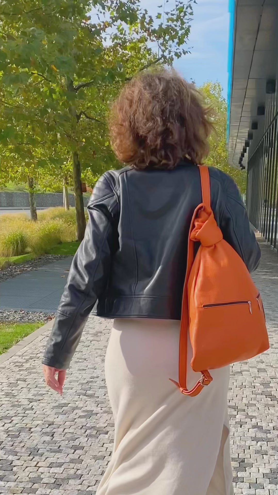 City Leather Backpack for women on shoulders of womasn