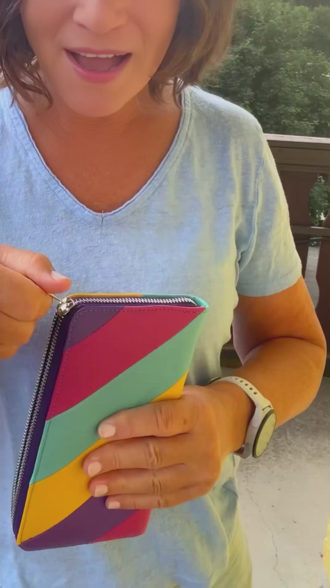 Leather wallet presented by a women outside in the nature